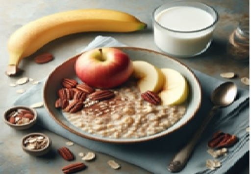 Un desayuno que consta de un plato hondo con avena y manzana además de nueces y un vaso de leche